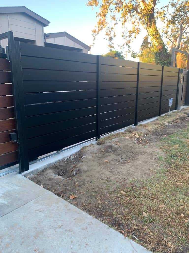 Modern black horizontal-slat privacy fence