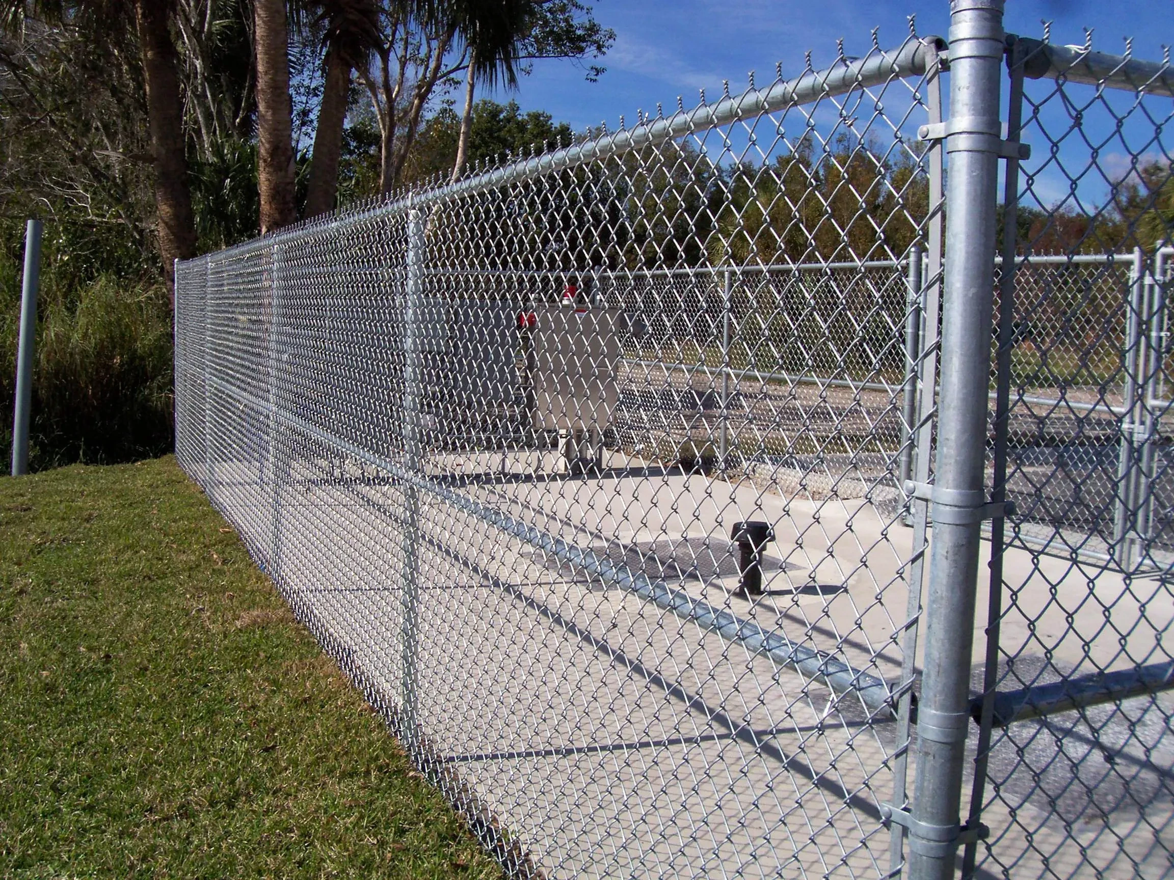 Chain-link fence with gate at commercial property